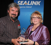 Peter Busbridge of Southbound Locksmiths is presented with the 2011 Business Of The Year Award